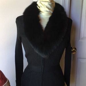 Form Fitting Fur collared sweater.